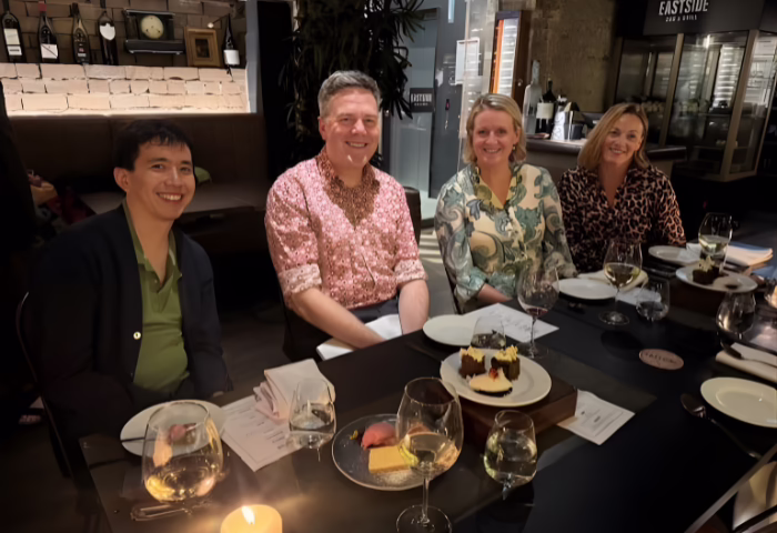 Vision Eye Institute's Dr Chris Go, Chris Hodge, Amanda Cranage and Siobhan Todhunter are seated at a table while dining out together.