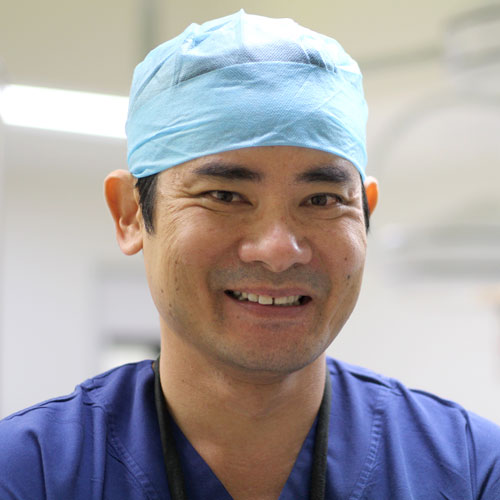 Dr Vu in surgical scrubs and cap