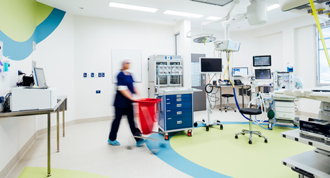 nurse walking through operating room | Vision Hospital Group